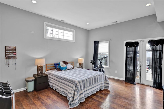 bedroom with access to exterior and dark hardwood / wood-style floors