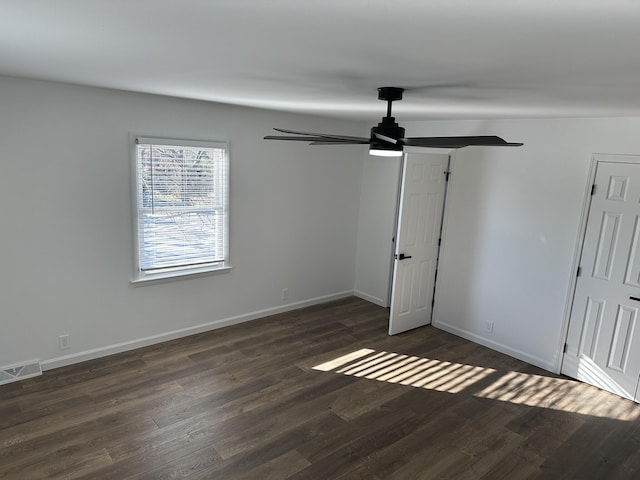 interior space with dark hardwood / wood-style flooring and ceiling fan