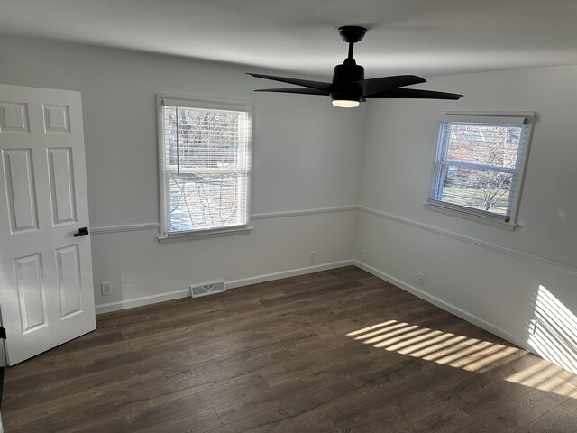 corridor featuring dark hardwood / wood-style floors and a notable chandelier