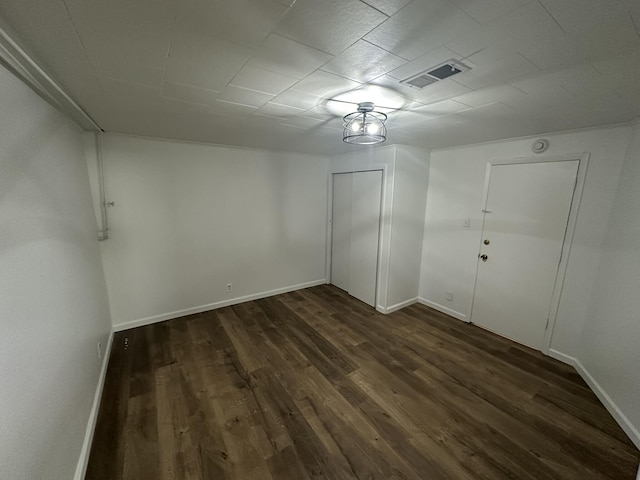 unfurnished room featuring dark hardwood / wood-style floors