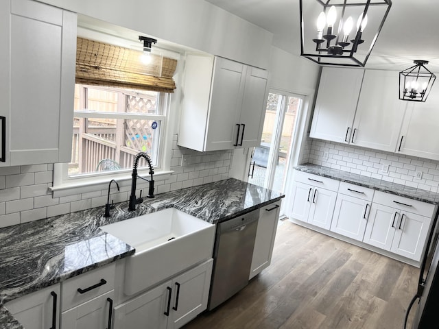 kitchen with hanging light fixtures and white cabinets