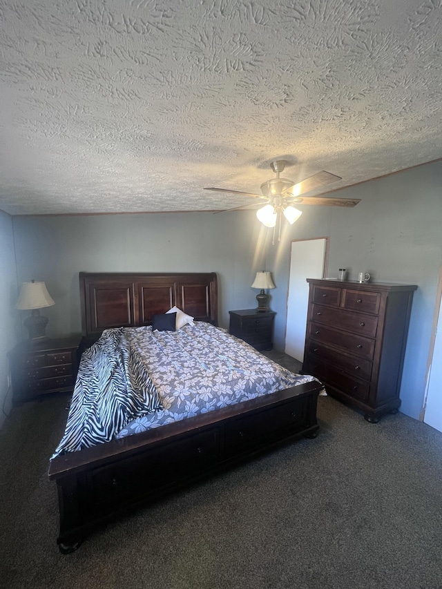 carpeted bedroom with a textured ceiling and ceiling fan