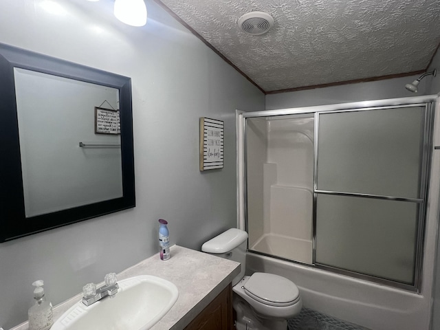 full bathroom featuring bath / shower combo with glass door, vanity, a textured ceiling, vaulted ceiling, and toilet