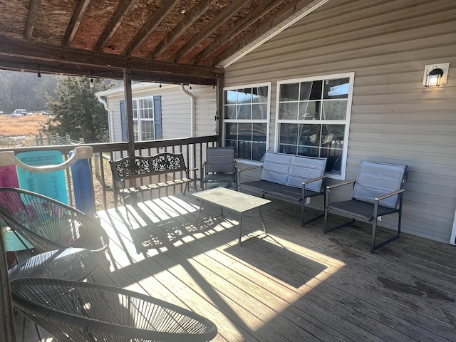 wooden terrace featuring outdoor lounge area