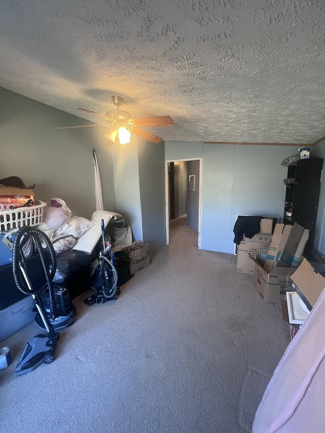 interior space with carpet, a textured ceiling, and ceiling fan