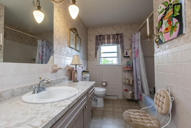 full bathroom featuring shower / tub combo with curtain, tile walls, vanity, baseboard heating, and toilet