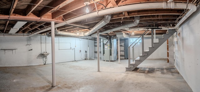 basement with sink and heating unit