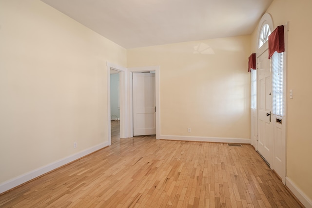 empty room with light wood-type flooring