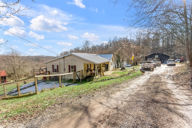 view of property exterior with covered porch