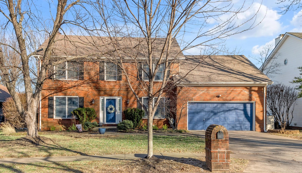 view of front of property with a garage