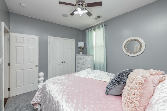 carpeted bedroom with ceiling fan and a closet