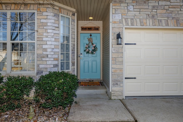 view of exterior entry featuring a garage