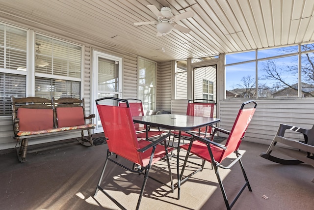 sunroom / solarium featuring ceiling fan