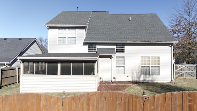 back of property featuring a sunroom