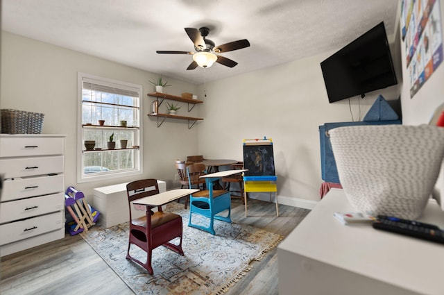 office with ceiling fan and wood-type flooring