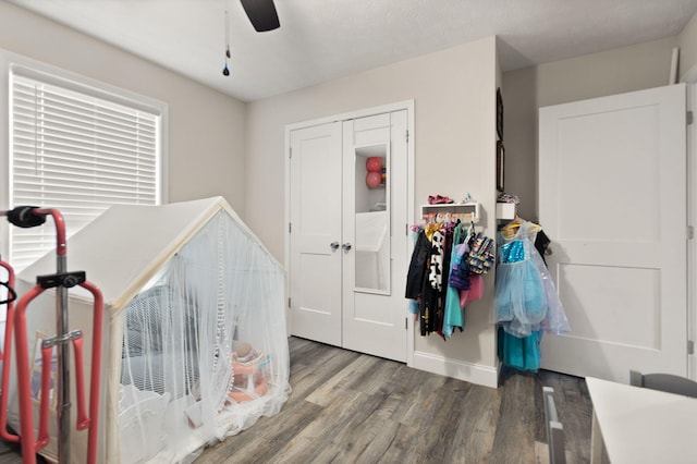 bedroom featuring wood-type flooring and ceiling fan