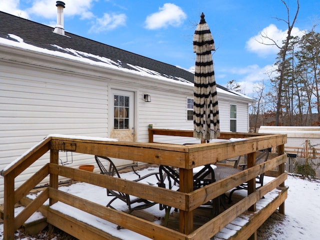 view of snow covered deck