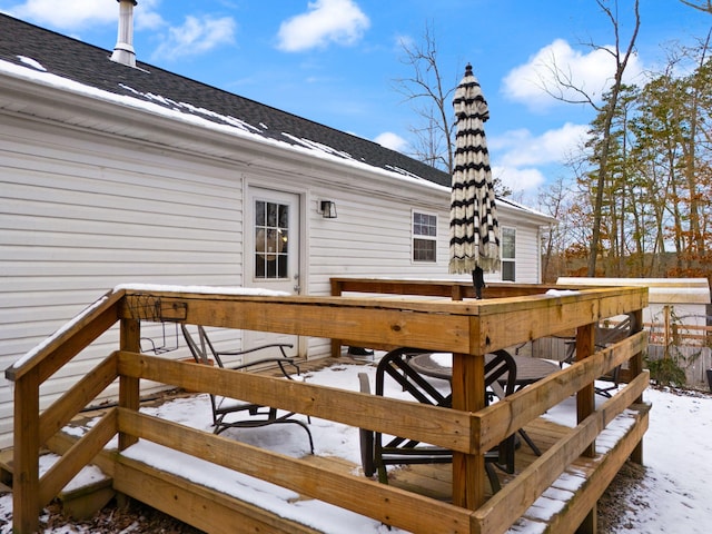 view of snow covered deck