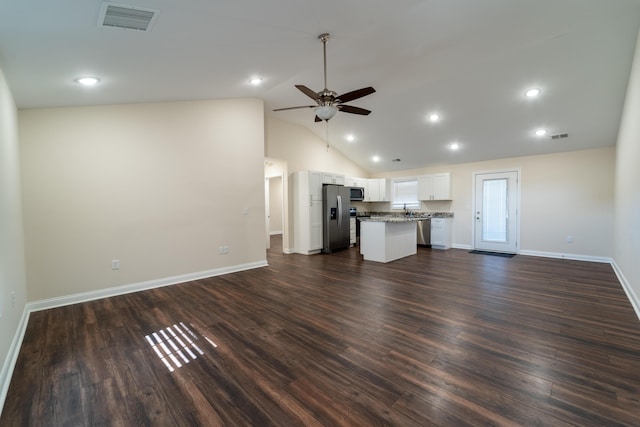 unfurnished living room featuring high vaulted ceiling, dark wood-type flooring, sink, and ceiling fan