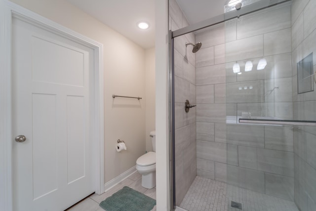 bathroom with walk in shower and toilet