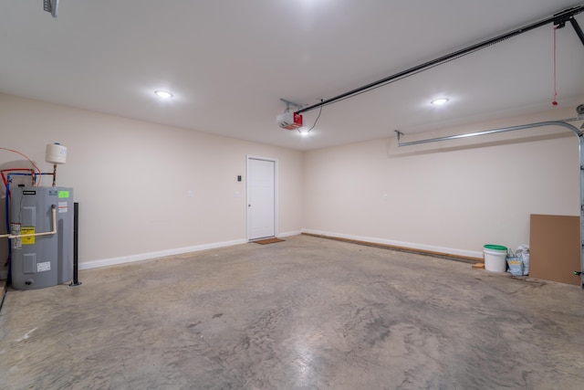 garage featuring a garage door opener and electric water heater