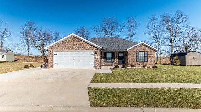 2053 Partridge Way, Richmond, KY 40475 - view of front of property featuring a front yard, brick siding, a garage, and driveway