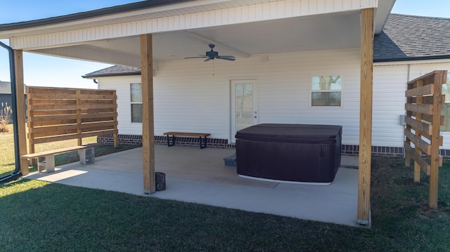 view of patio with a hot tub and ceiling fan