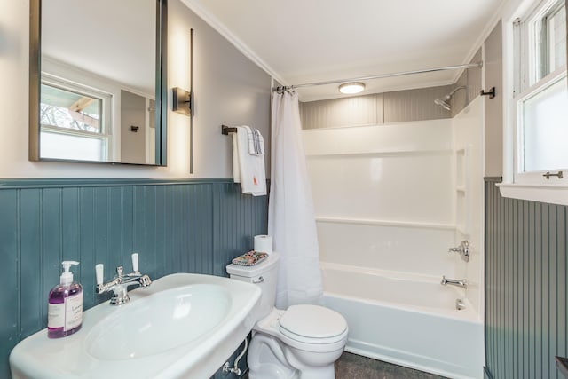 full bathroom with toilet, shower / bathtub combination with curtain, and sink