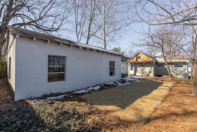 rear view of house featuring a yard