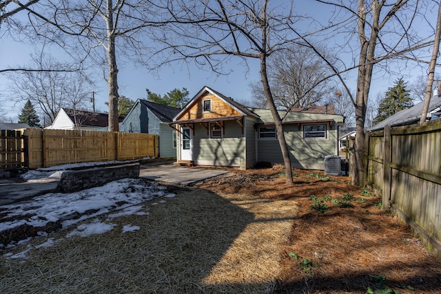 back of property featuring central AC unit and a patio area