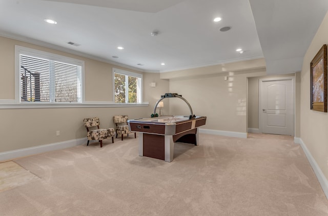 playroom featuring ornamental molding and light colored carpet