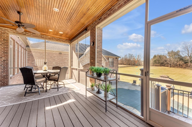 wooden deck featuring ceiling fan