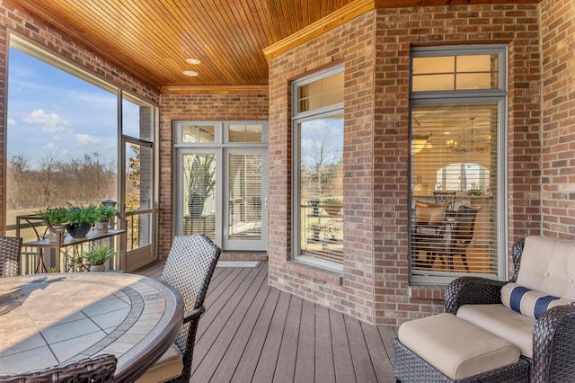 sunroom / solarium featuring wood ceiling