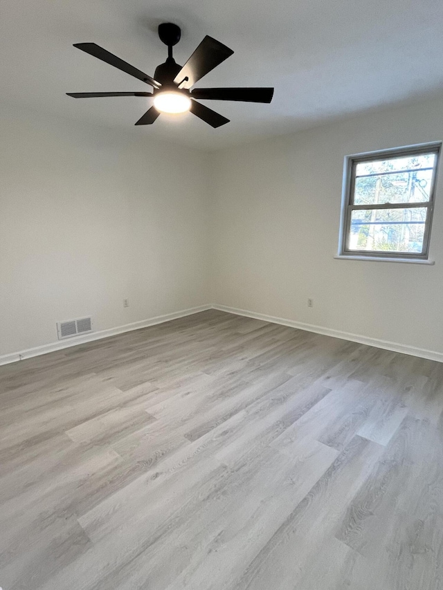 spare room featuring light wood-type flooring