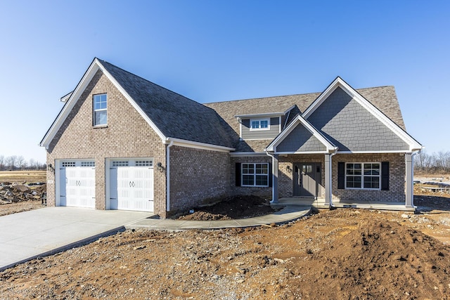 100 Zane Ln, Nicholasville, KY 40356 - craftsman-style house featuring concrete driveway, a porch, and brick siding