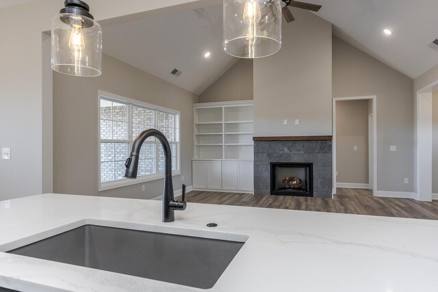 kitchen with plenty of natural light, a sink, and baseboards