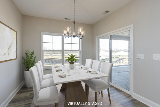 unfurnished dining area with dark wood-style flooring, visible vents, and baseboards