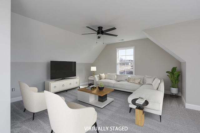 living room featuring a ceiling fan, lofted ceiling, carpet flooring, and baseboards