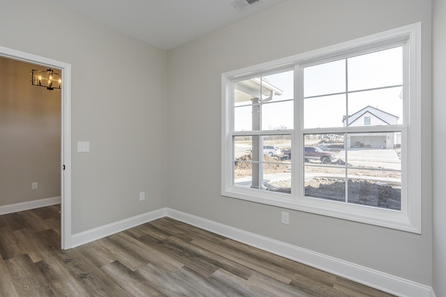 100 Zane Ln, Nicholasville, KY 40356 - empty room with an inviting chandelier, baseboards, and dark wood-style floors