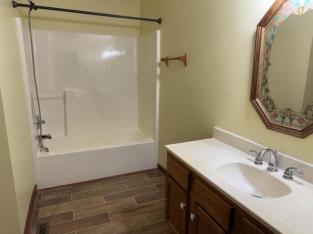 bathroom featuring vanity and tub / shower combination