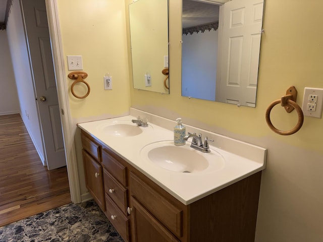 bathroom with vanity and hardwood / wood-style flooring