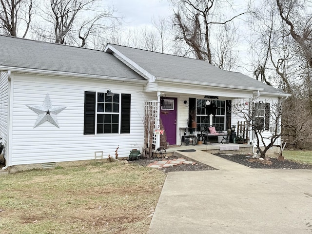 view of front facade with a front yard and a porch