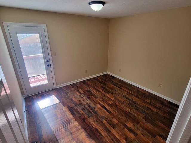 empty room featuring dark wood-type flooring