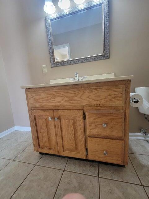 bathroom with tile patterned flooring and vanity