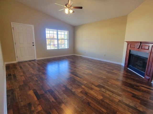 unfurnished living room with ceiling fan, dark hardwood / wood-style floors, and vaulted ceiling