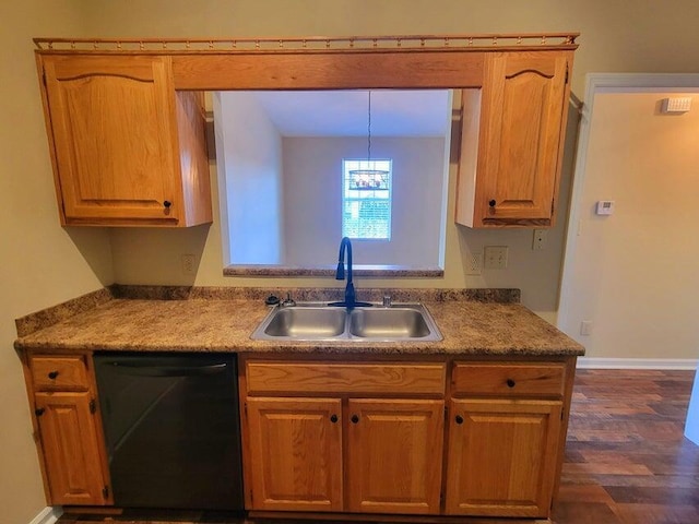 kitchen featuring dark hardwood / wood-style flooring, decorative light fixtures, black dishwasher, and sink