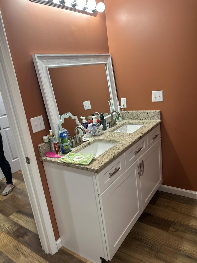 bathroom featuring vanity and wood-type flooring