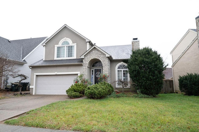 view of front of home featuring a garage and a front lawn