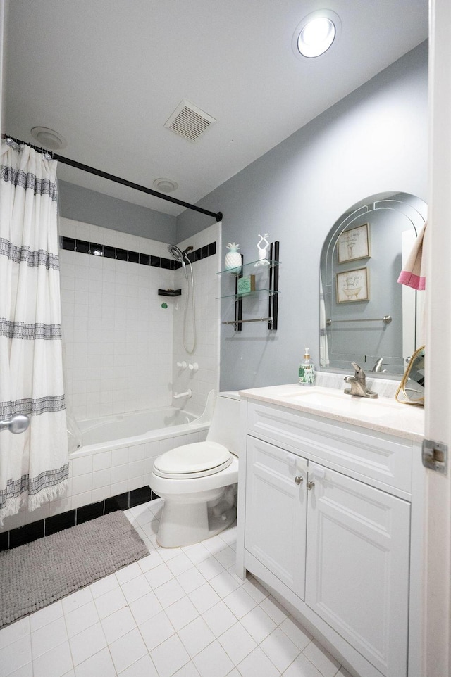 full bathroom featuring shower / tub combo, vanity, tile patterned floors, and toilet