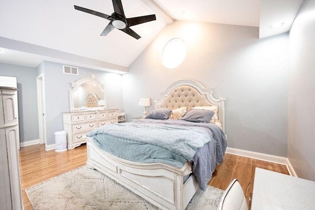 bedroom with vaulted ceiling with beams, light hardwood / wood-style flooring, and ceiling fan